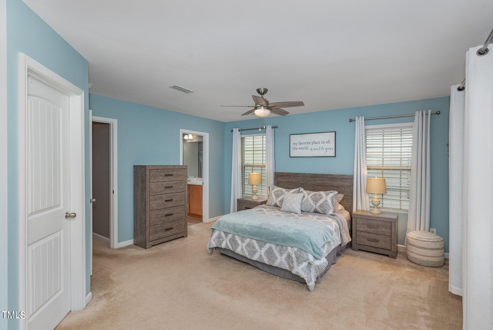 3743 Landshire View Lane Raleigh, NC 27616 - Photo 13 of 28 a bedroom with a bed and a view of walk in closet