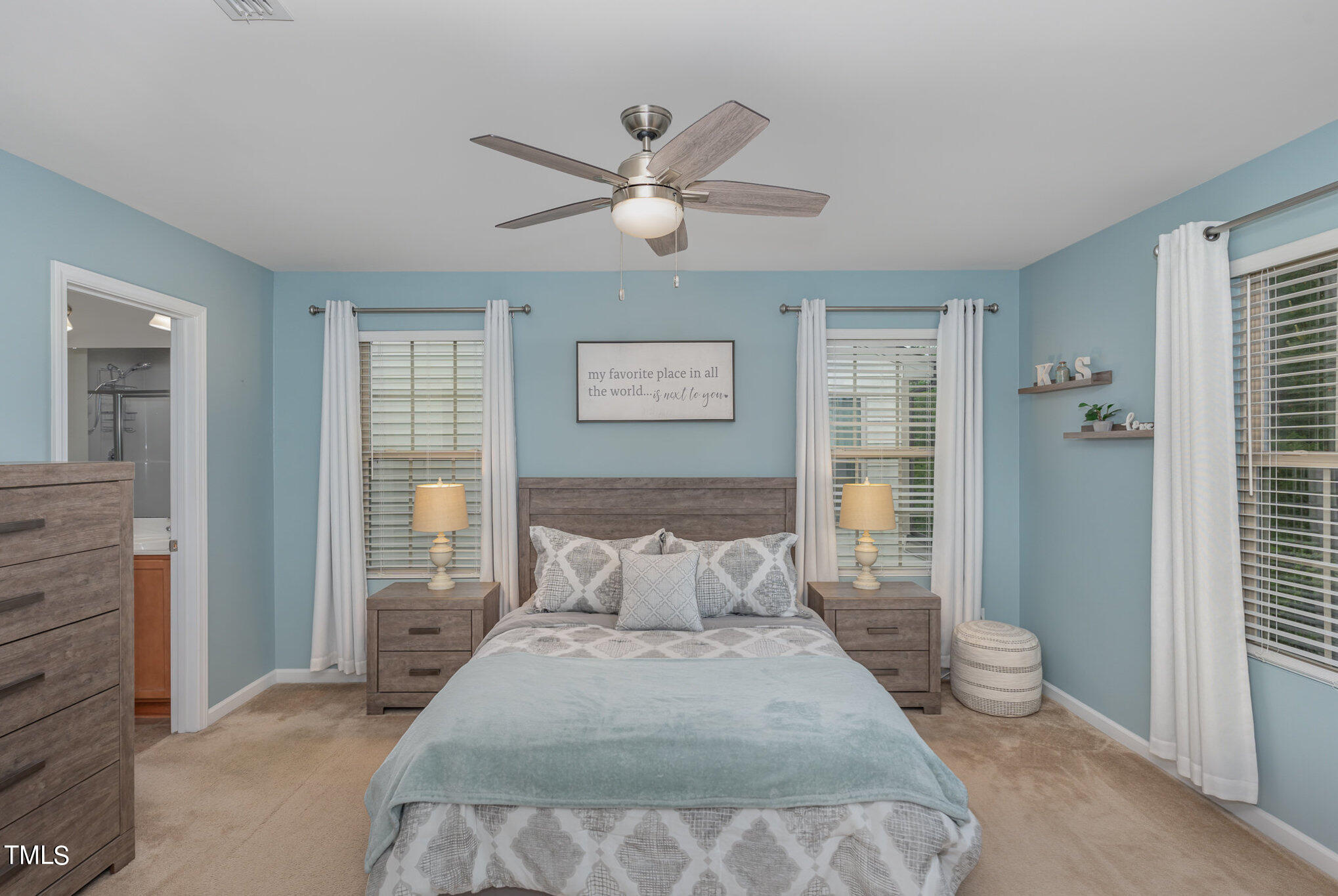 3743 Landshire View Lane Raleigh, NC 27616 - Photo 15 of 28 a bedroom with a large bed and a chandelier