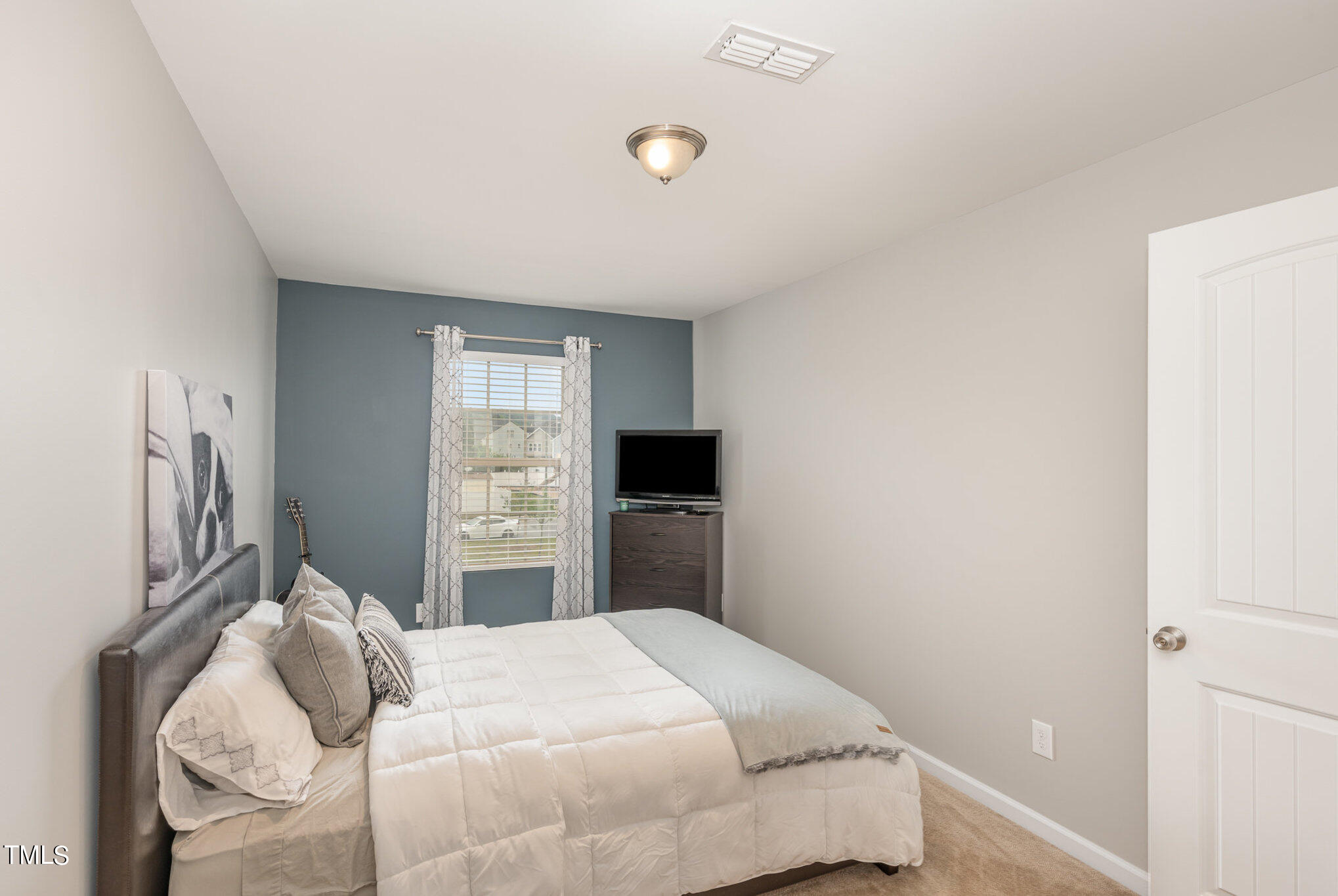 3743 Landshire View Lane Raleigh, NC 27616 - Photo 20 of 28 a bedroom with a bed and a window