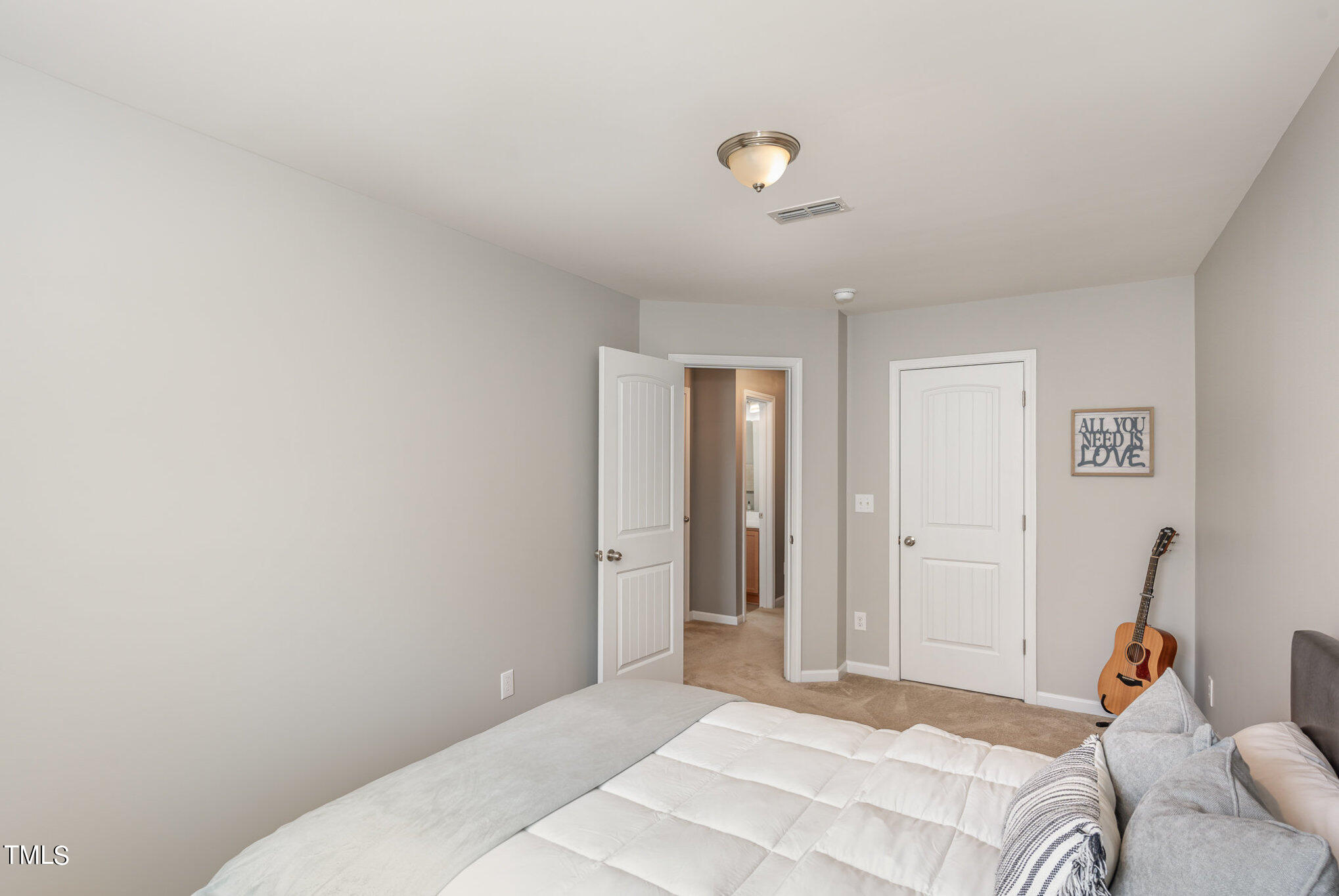 3743 Landshire View Lane Raleigh, NC 27616 - Photo 21 of 28 a bedroom with a bed and a couch