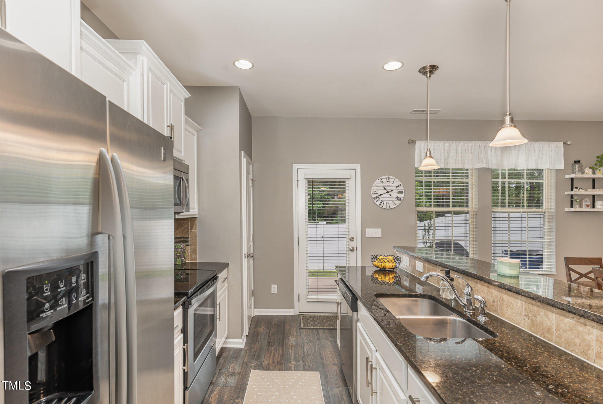 3743 Landshire View Lane Raleigh, NC 27616 - Photo 9 of 28 a kitchen with granite countertop a sink stainless steel appliances and cabinets