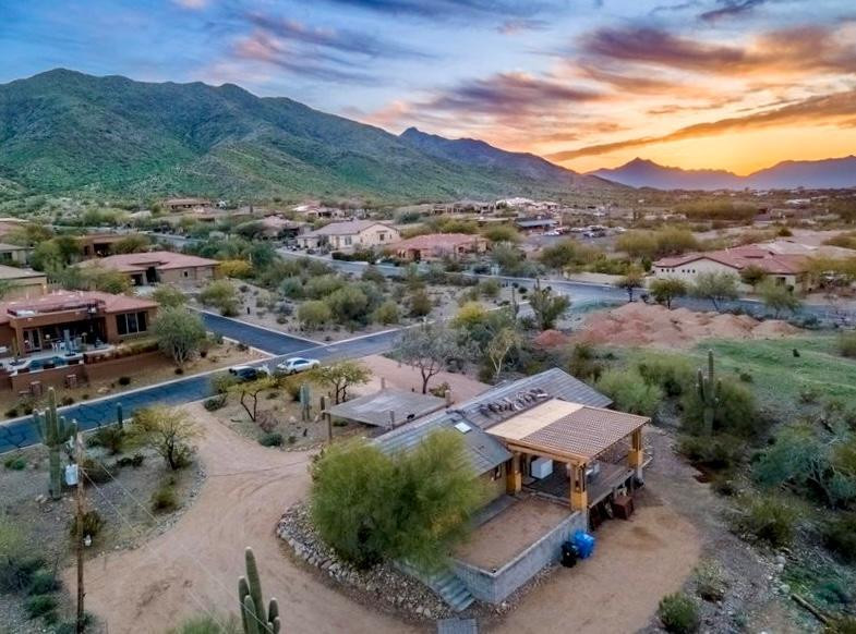 1750 West Pearce Road Phoenix, AZ 85041 - Photo 2 of 39 an aerial view of a house with a mountain
