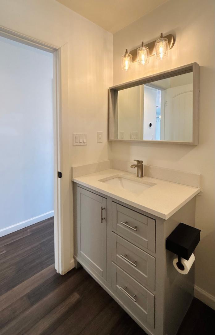 1750 West Pearce Road Phoenix, AZ 85041 - Photo 21 of 39 a bathroom with a sink and a mirror