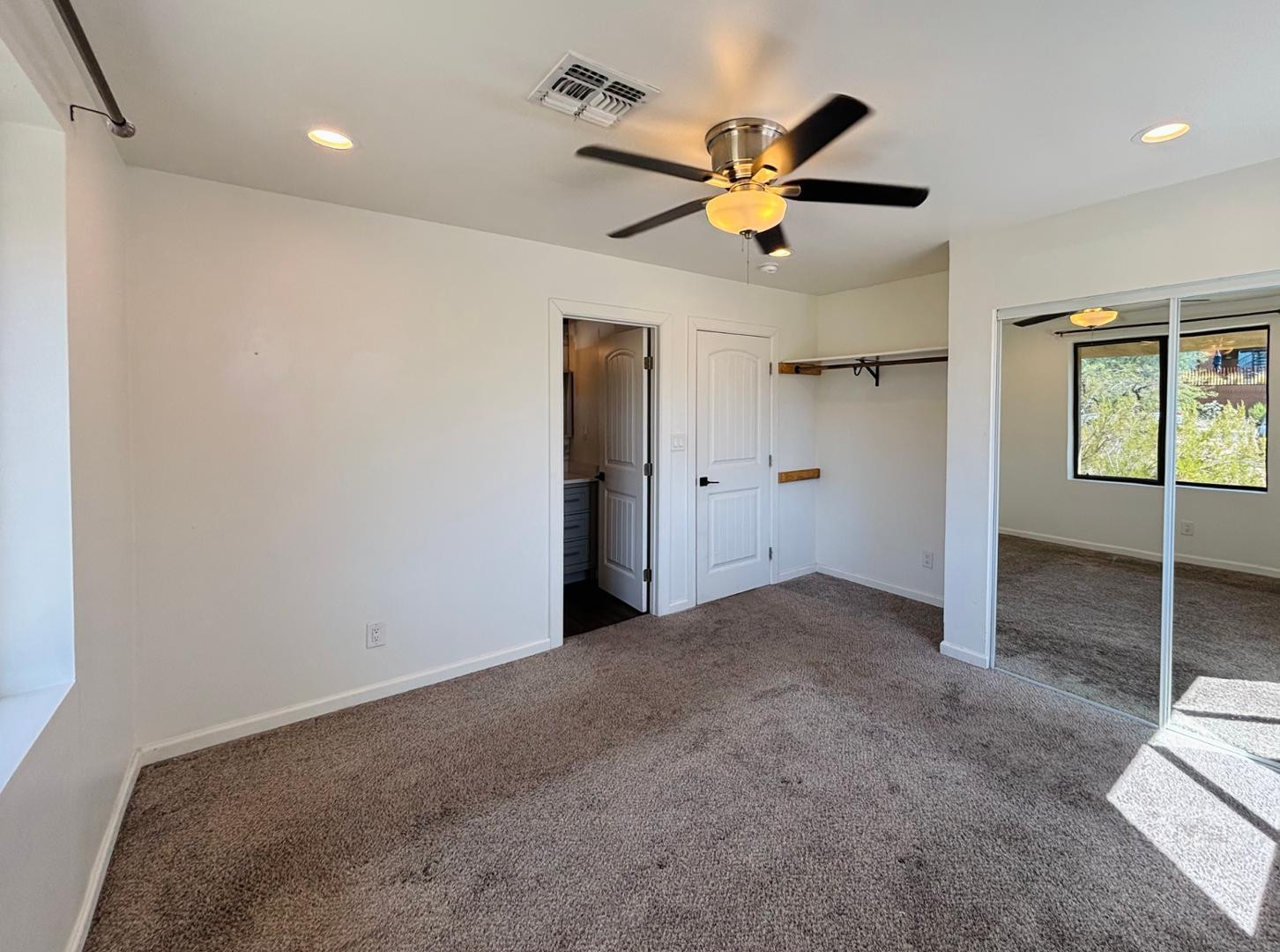 1750 West Pearce Road Phoenix, AZ 85041 - Photo 37 of 39 a view of a livingroom with a ceiling fan and window