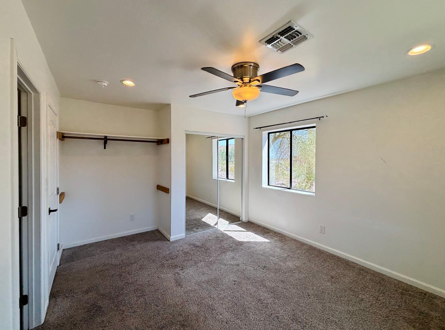 1750 West Pearce Road Phoenix, AZ 85041 - Photo 38 of 39 a view of a big room with a chandelier fan and a chandelier fan