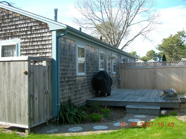 101 Lower County Road, Unit 3B Dennis Port, MA 02639 - Photo 3 of 8 a view of a house with backyard and sitting area