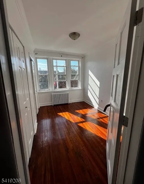 1254 Paterson Plank Road, Unit 2B Secaucus, NJ 07094 - Photo 1 of 5 a blue bed sitting in a room next to a window