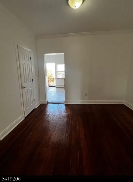 1254 Paterson Plank Road, Unit 2B Secaucus, NJ 07094 - Photo 3 of 5 a view of empty room with wooden floor and fan