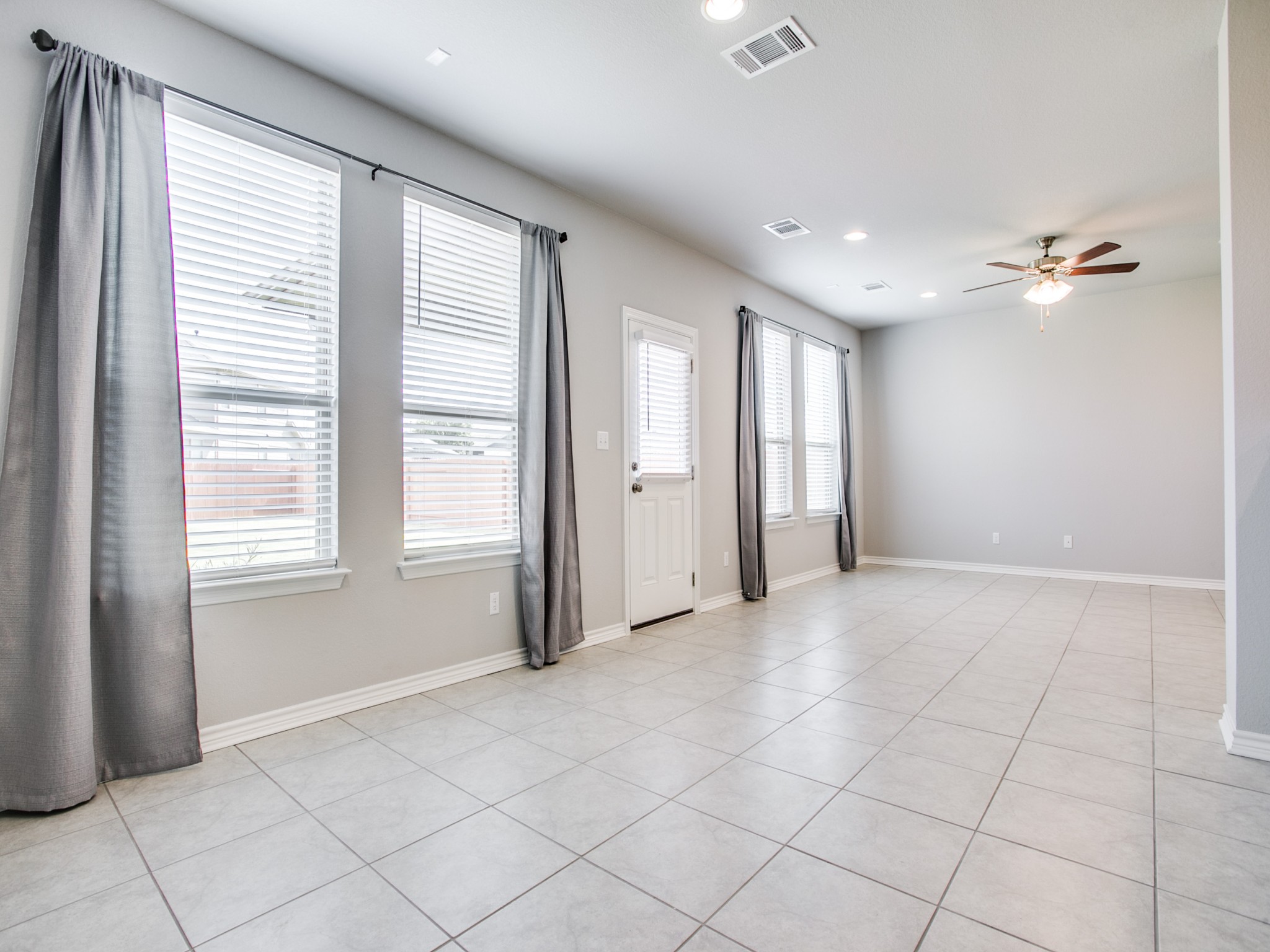 508 Rearing Mare Pass Georgetown, TX 78626 - Photo 8 of 26 Family room with ceiling fan, recessed lighting, light tile patterned floors, and baseboards