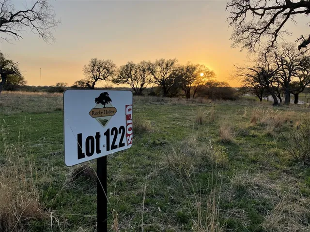 a sign that is on the side of a yard