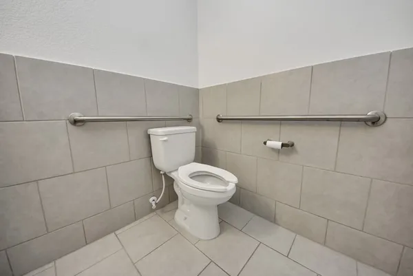 a bathroom with a toilet and a sink