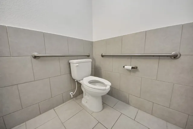 a bathroom with a toilet and a sink