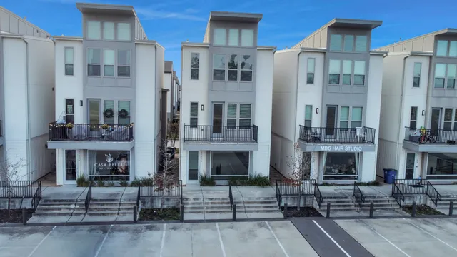 a front view of a brick building with many windows