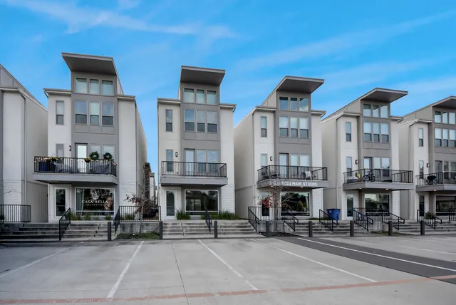 a view of building with cars