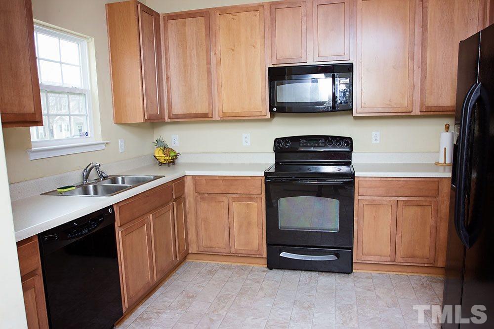 3537 Londonville Lane Raleigh, NC 27604 - Photo 2 of 21 a kitchen with stainless steel appliances granite countertop a sink stove and microwave