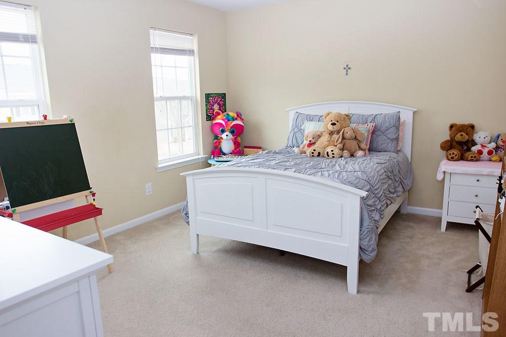 3537 Londonville Lane Raleigh, NC 27604 - Photo 13 of 21 a bedroom with a bed and a window