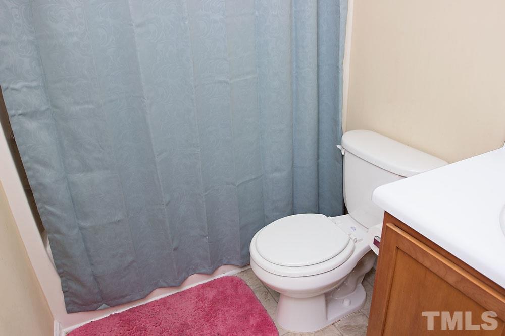 3537 Londonville Lane Raleigh, NC 27604 - Photo 14 of 21 a white toilet sitting next to a shower