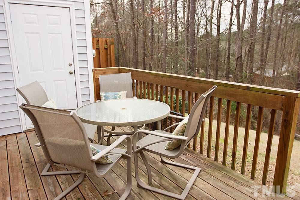 3537 Londonville Lane Raleigh, NC 27604 - Photo 16 of 21 a view of a chairs and table on the deck