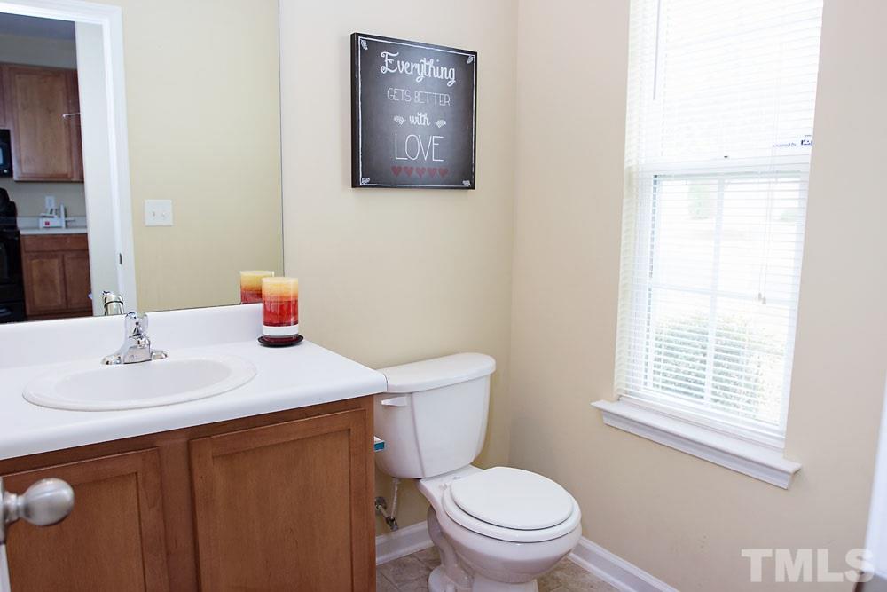 3537 Londonville Lane Raleigh, NC 27604 - Photo 6 of 21 a bathroom with a toilet a sink and a window