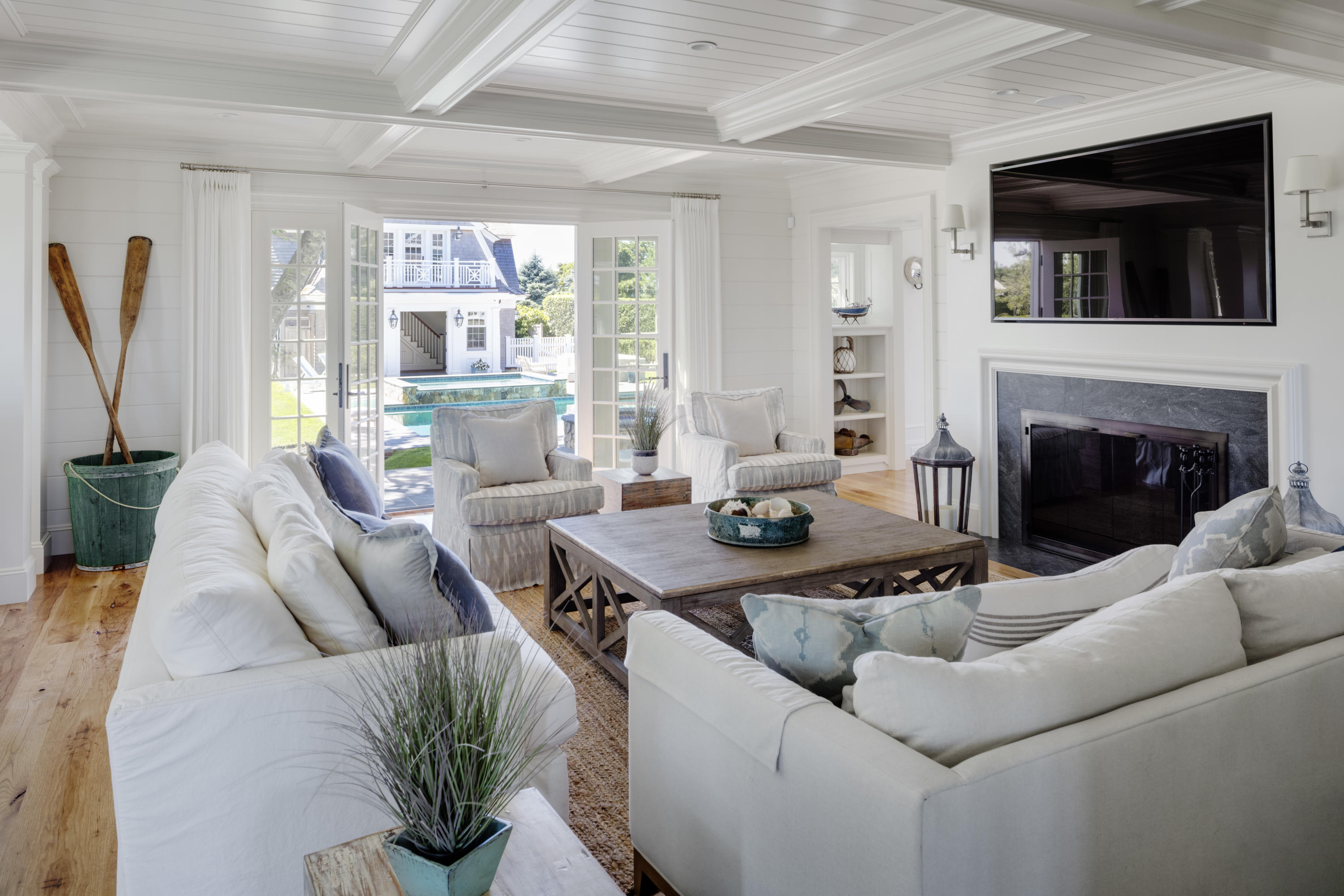 103 Shore Road Chatham, MA 02633 - Photo 17 of 32 a living room with furniture a flat screen tv and a fireplace
