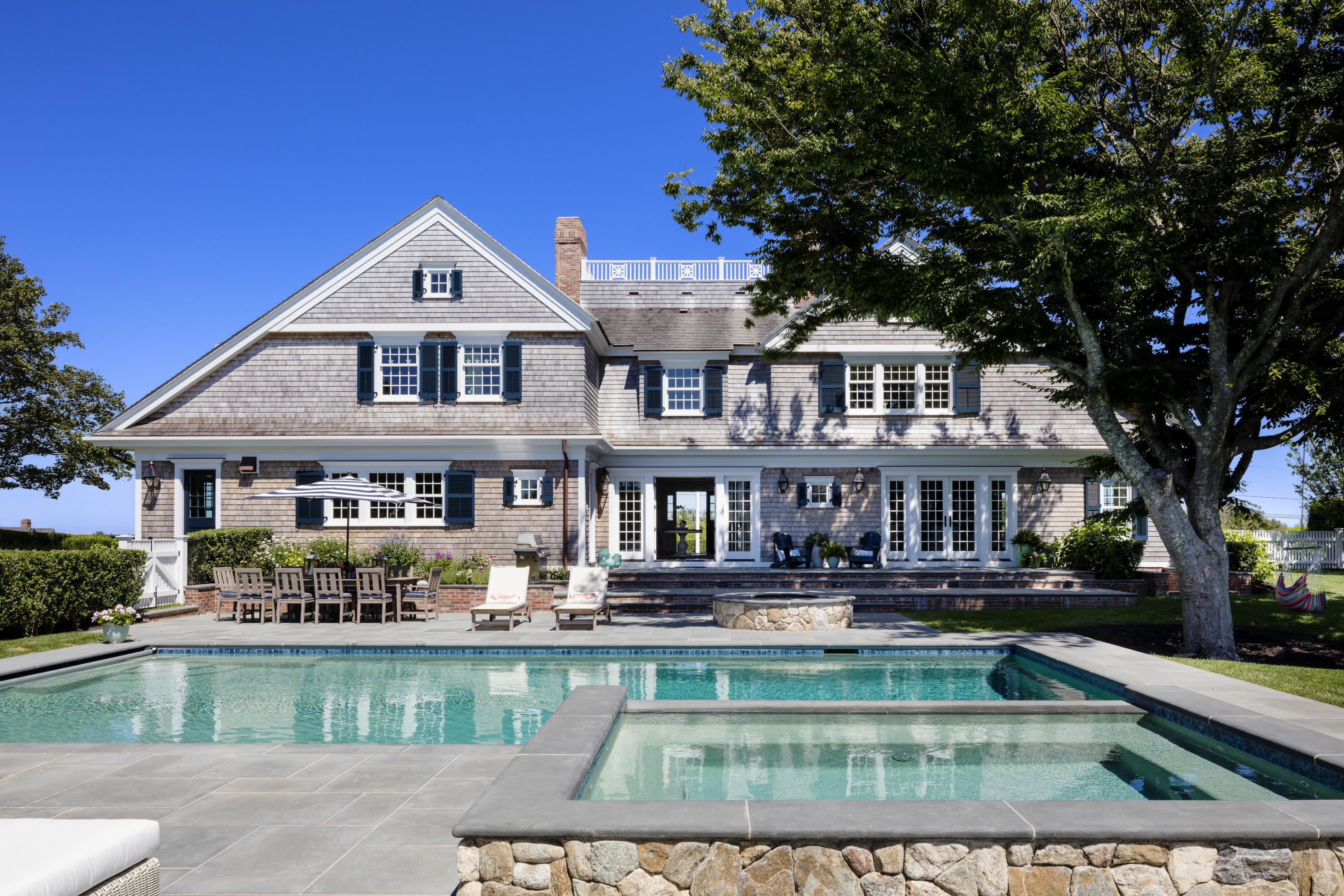 103 Shore Road Chatham, MA 02633 - Photo 2 of 32 a front view of a house with swimming pool
