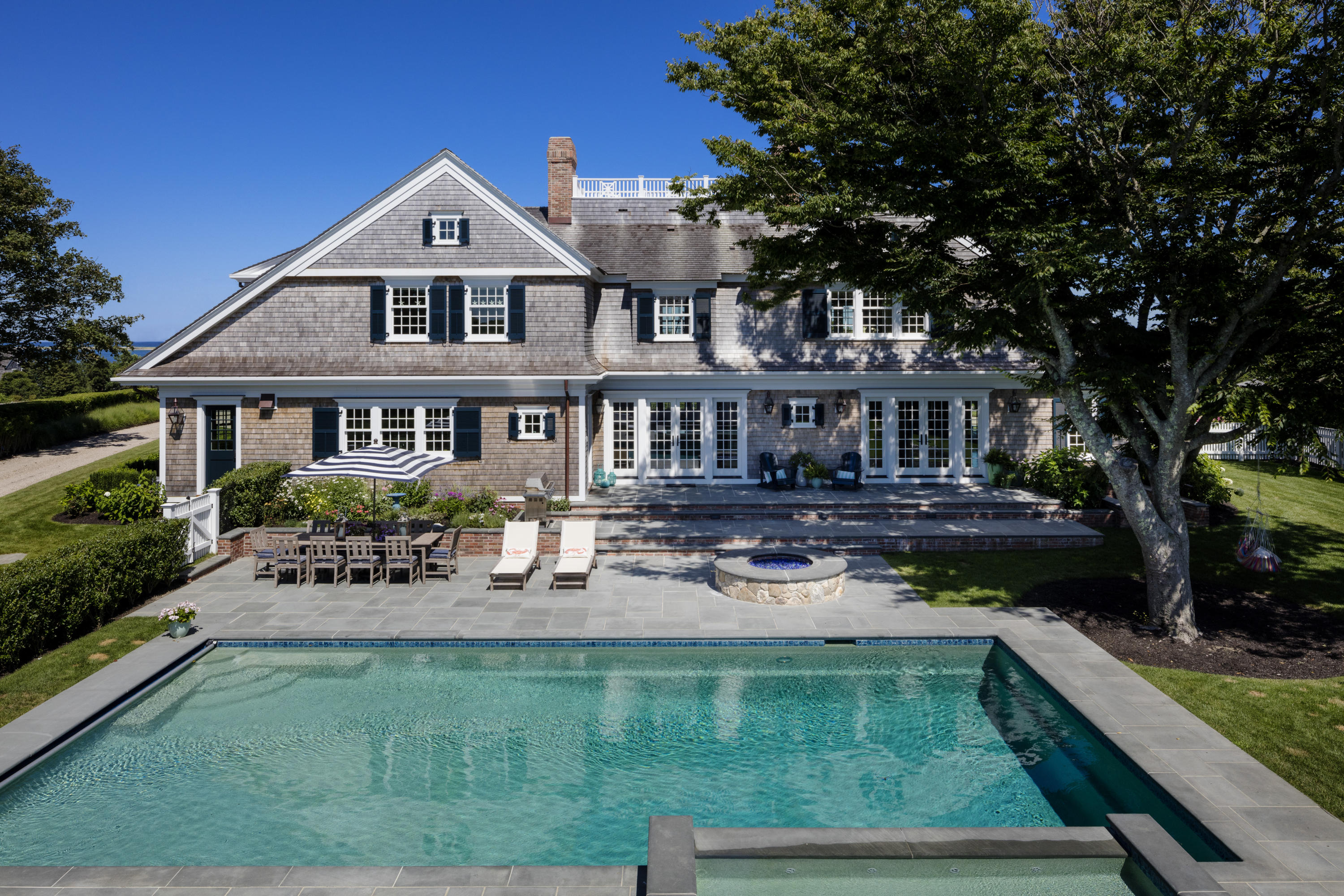 103 Shore Road Chatham, MA 02633 - Photo 27 of 32 a house view with a seating space and a garden view