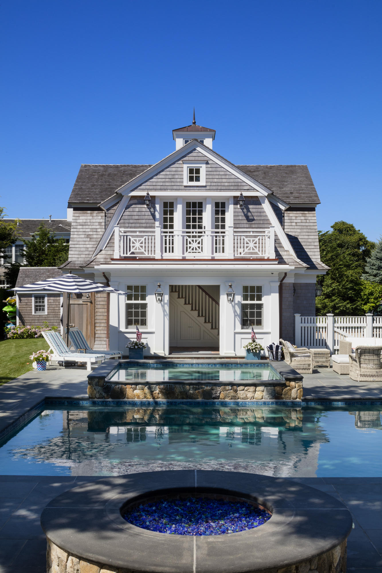 103 Shore Road Chatham, MA 02633 - Photo 4 of 32 a front view of a house with swimming pool