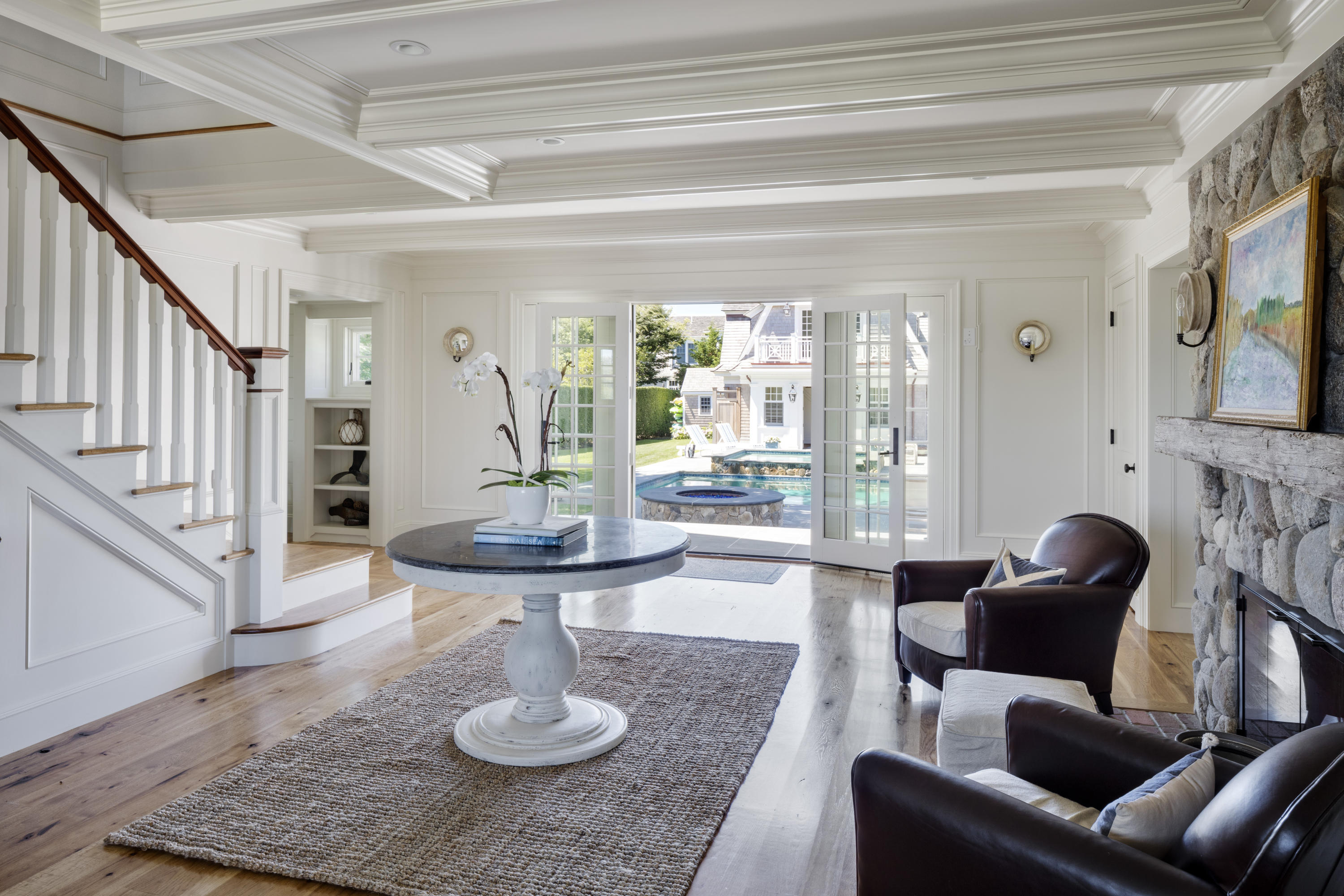 103 Shore Road Chatham, MA 02633 - Photo 6 of 32 a living room with furniture and a fireplace