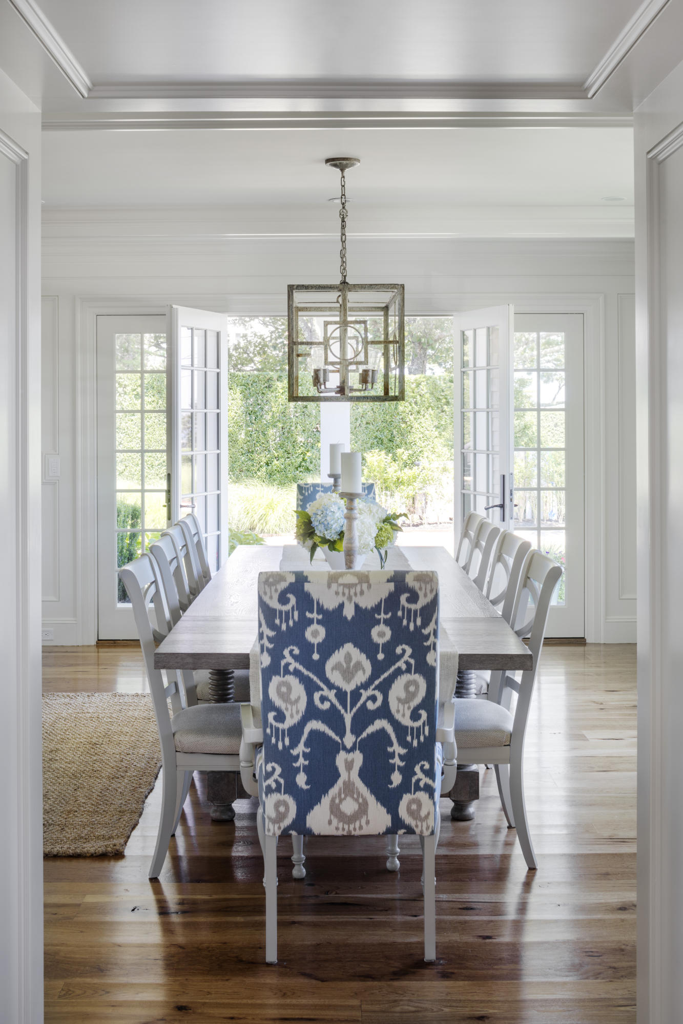 103 Shore Road Chatham, MA 02633 - Photo 9 of 32 a view of a dining room with furniture wooden floor and a chandelier