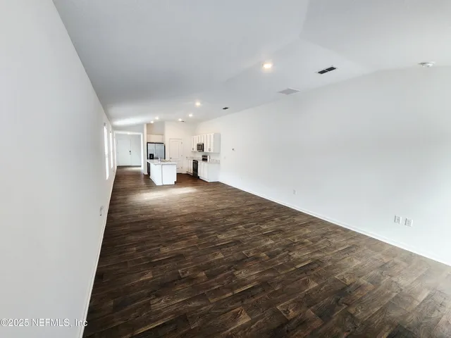 an empty room with a empty space and window