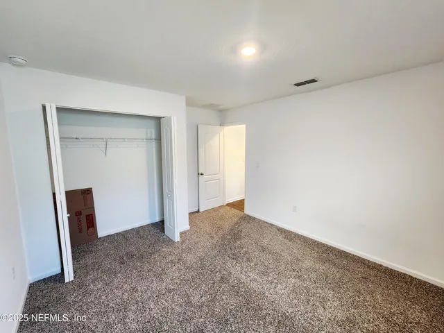 a view of a room with racks on the wall