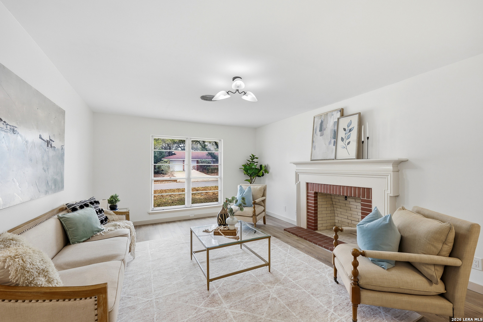 426 Zephyr Drive Windcrest, TX 78239 - Photo 19 of 33 a living room with furniture and a fireplace