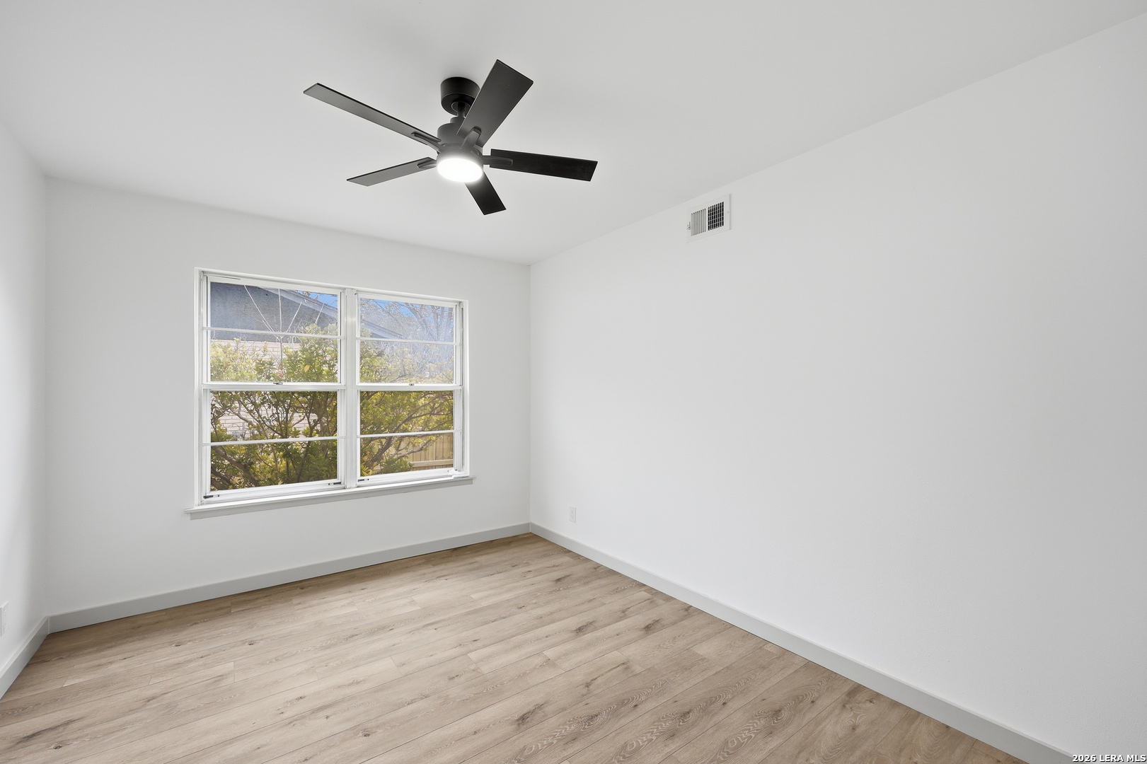 426 Zephyr Drive Windcrest, TX 78239 - Photo 25 of 33 a view of an empty room with a window