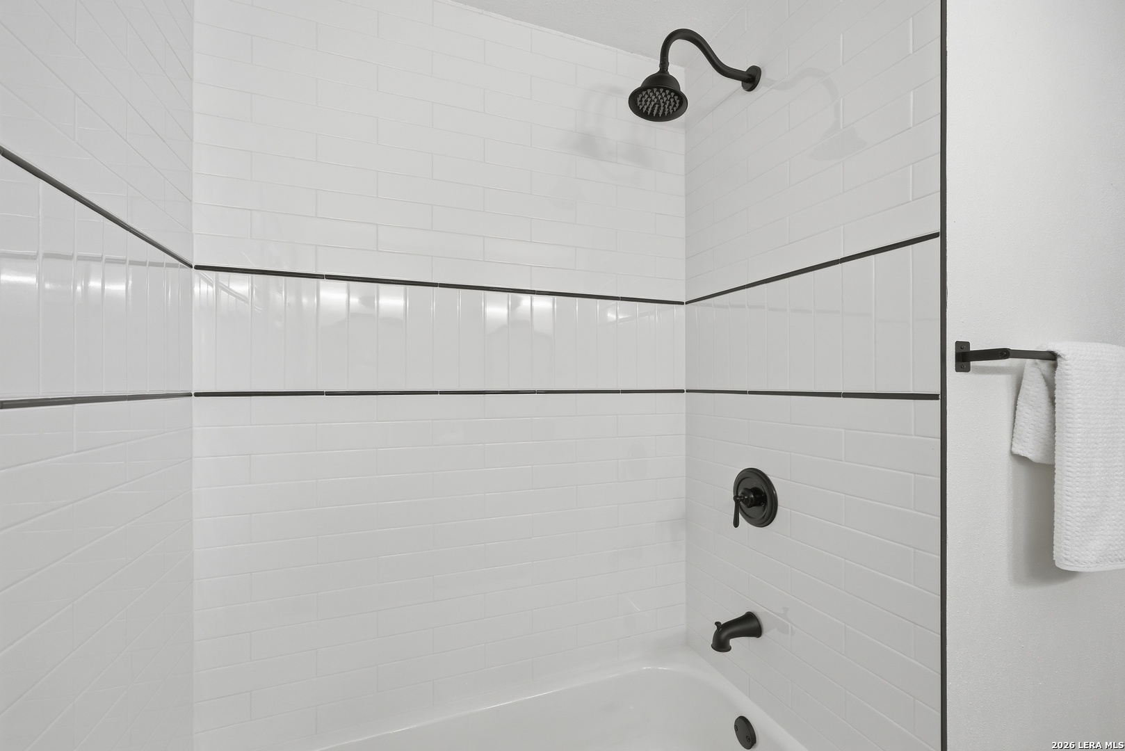 426 Zephyr Drive Windcrest, TX 78239 - Photo 27 of 33 a bathroom with a shower and a bath tub
