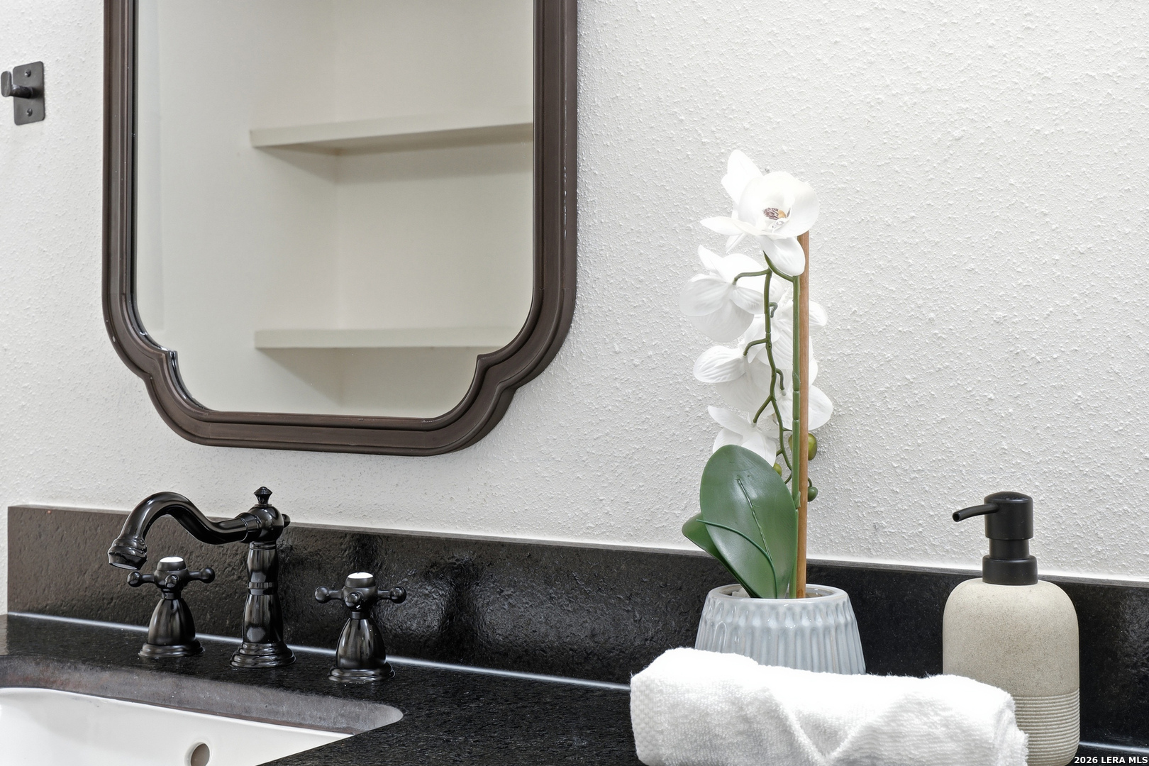 426 Zephyr Drive Windcrest, TX 78239 - Photo 29 of 33 a bathroom with a toilet sink and mirror
