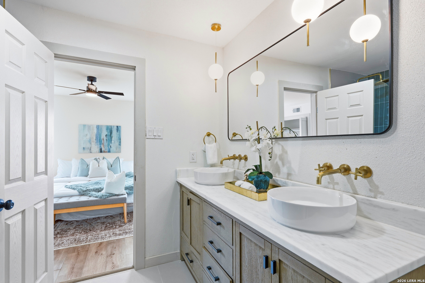 426 Zephyr Drive Windcrest, TX 78239 - Photo 7 of 33 a bathroom with a sink double vanity and a mirror