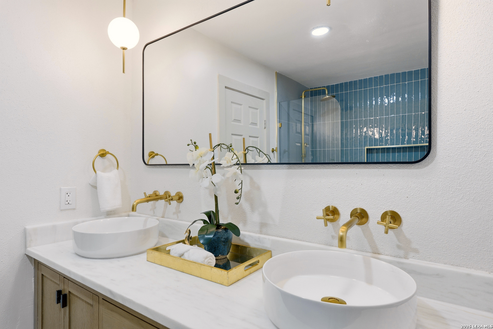 426 Zephyr Drive Windcrest, TX 78239 - Photo 10 of 33 a bathroom with a sink and a mirror