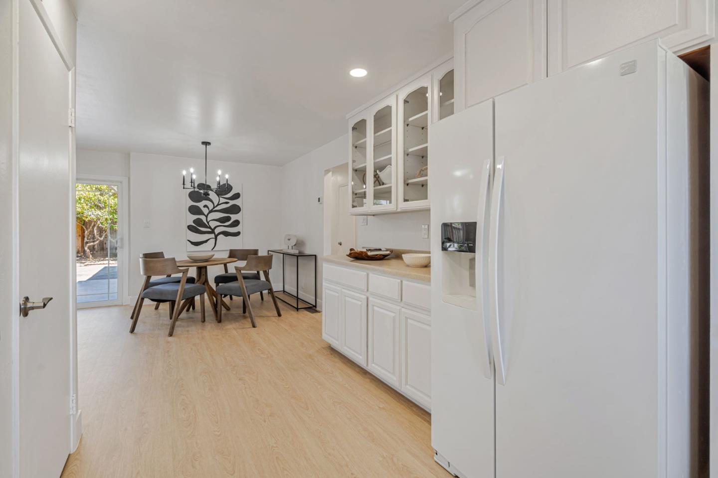 1069 Linda Drive Campbell, CA 95008 - Photo 11 of 39 a dining room with furniture and a chandelier
