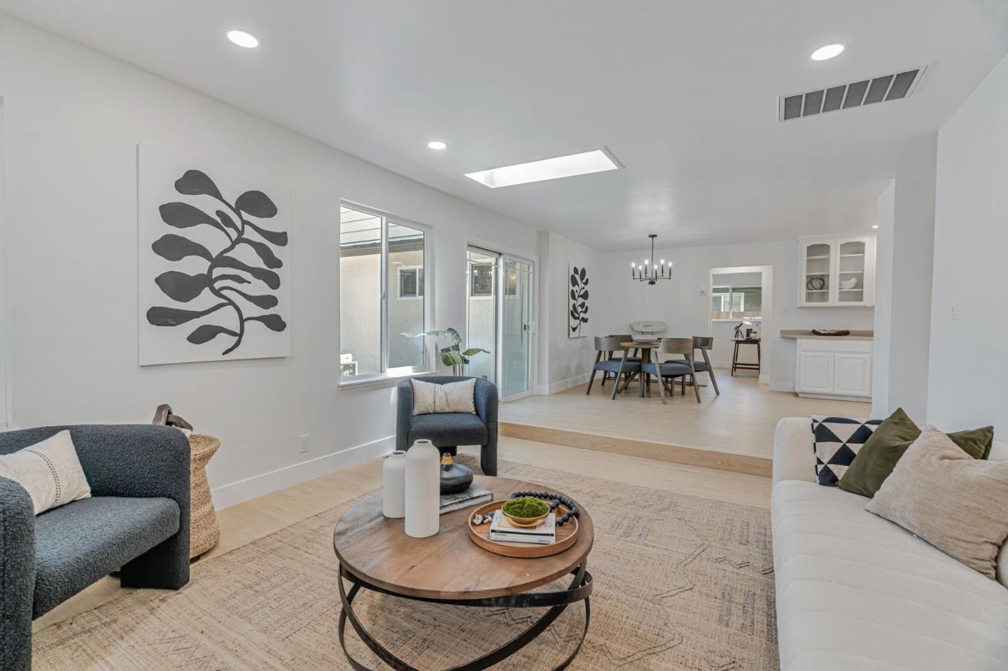 1069 Linda Drive Campbell, CA 95008 - Photo 8 of 39 a living room with furniture and a dining table with wooden floor