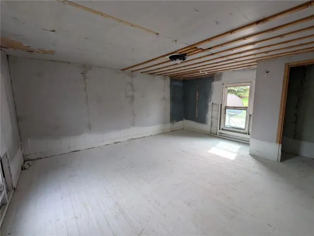 a bathroom with a tub a toilet and a shower