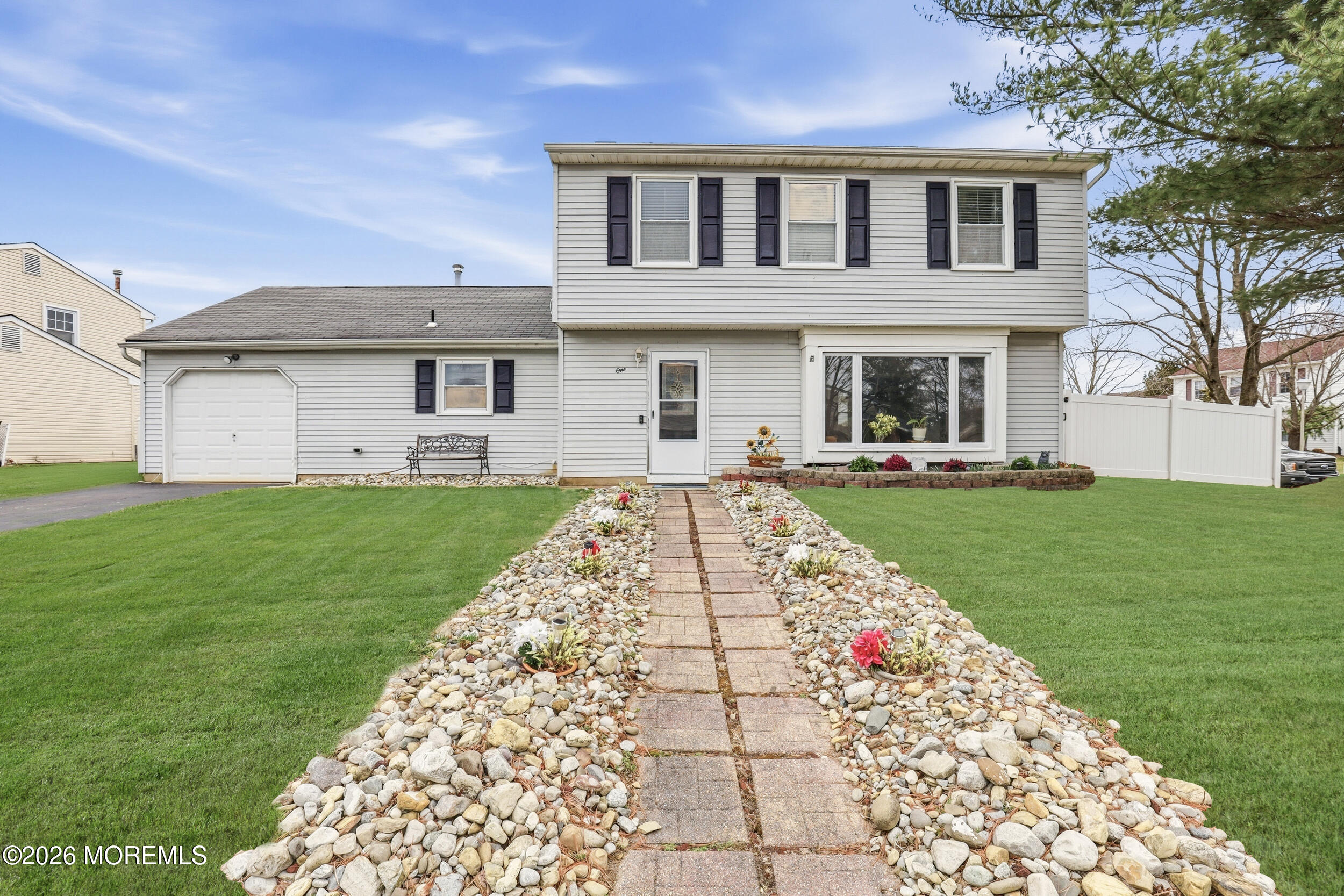 1 Mimi Lane Howell, NJ 07731 - Photo 1 of 26 a front view of a house with a garden