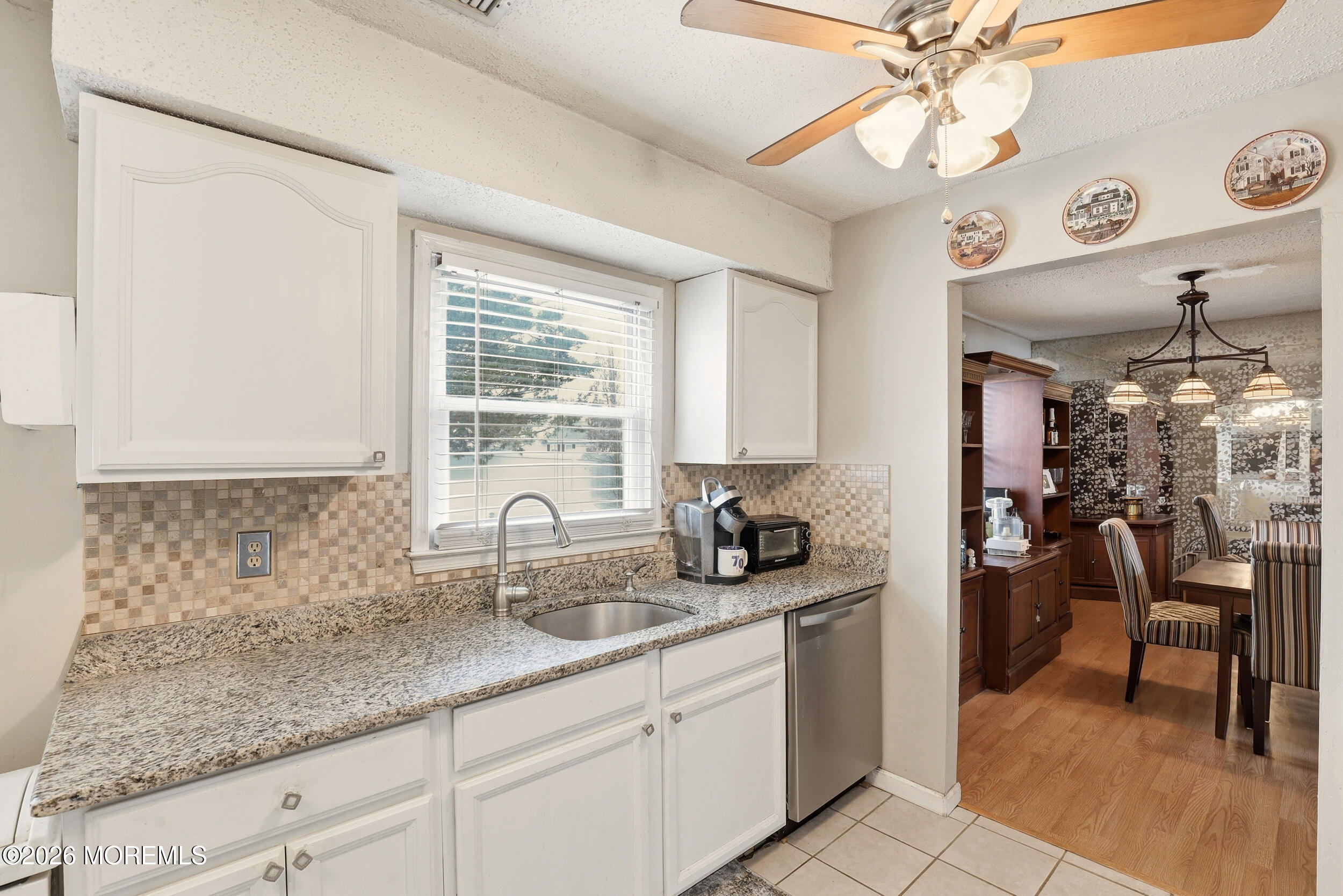1 Mimi Lane Howell, NJ 07731 - Photo 12 of 26 a kitchen with a sink and cabinets