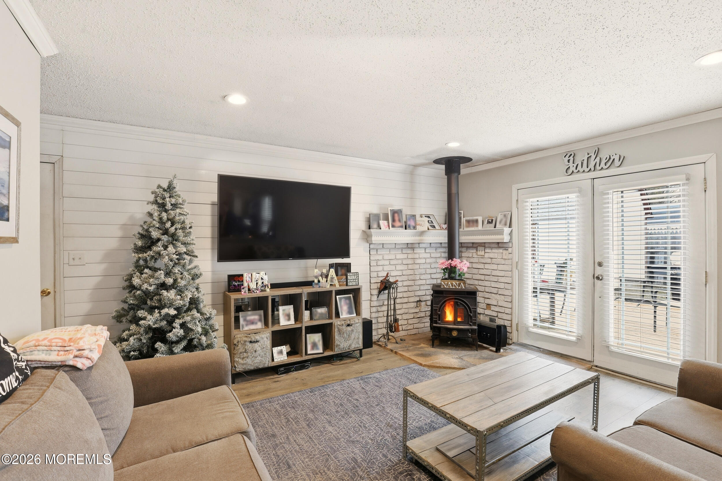 1 Mimi Lane Howell, NJ 07731 - Photo 15 of 26 a living room with furniture and a flat screen tv
