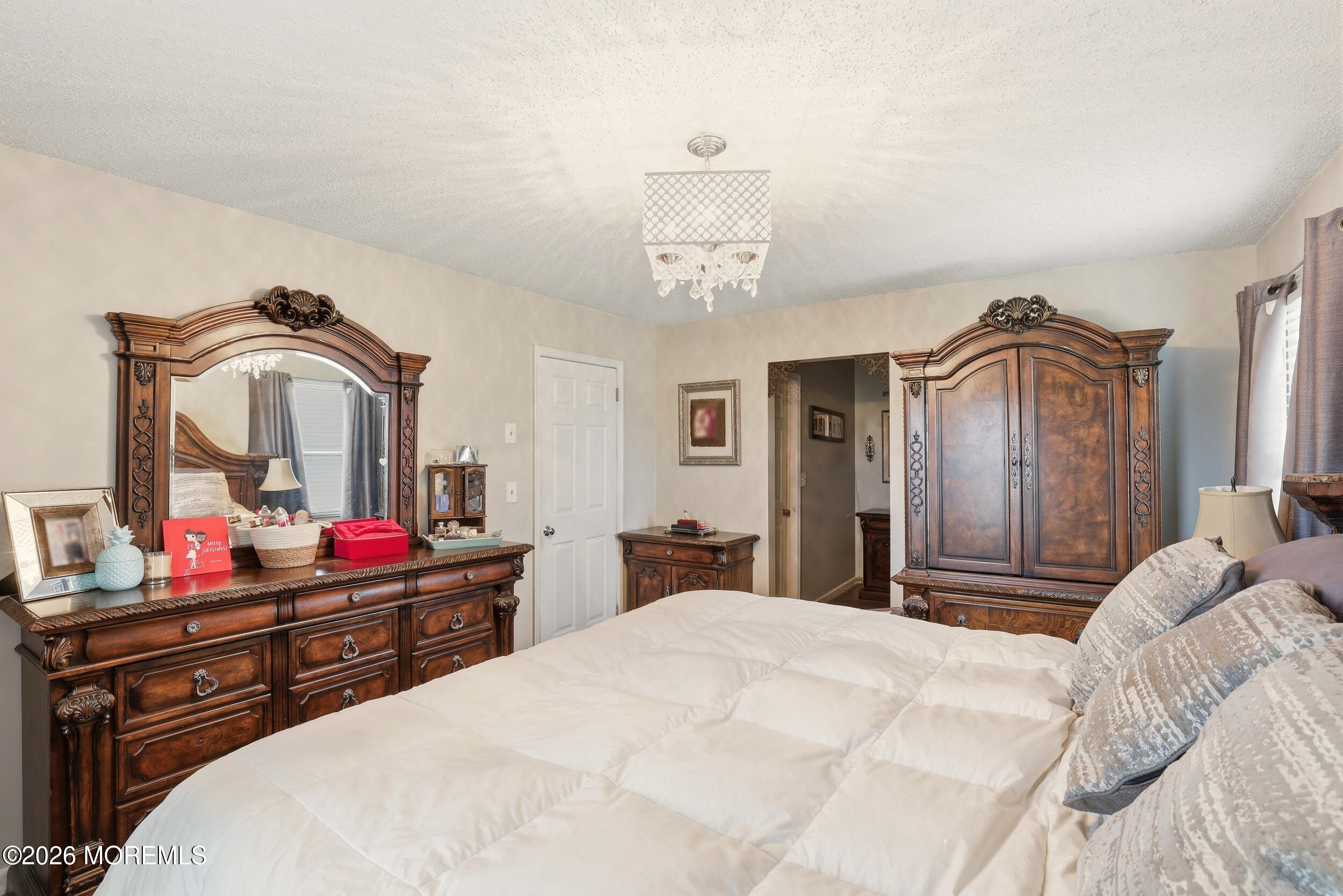 1 Mimi Lane Howell, NJ 07731 - Photo 21 of 26 a bedroom with a large bed and a dresser
