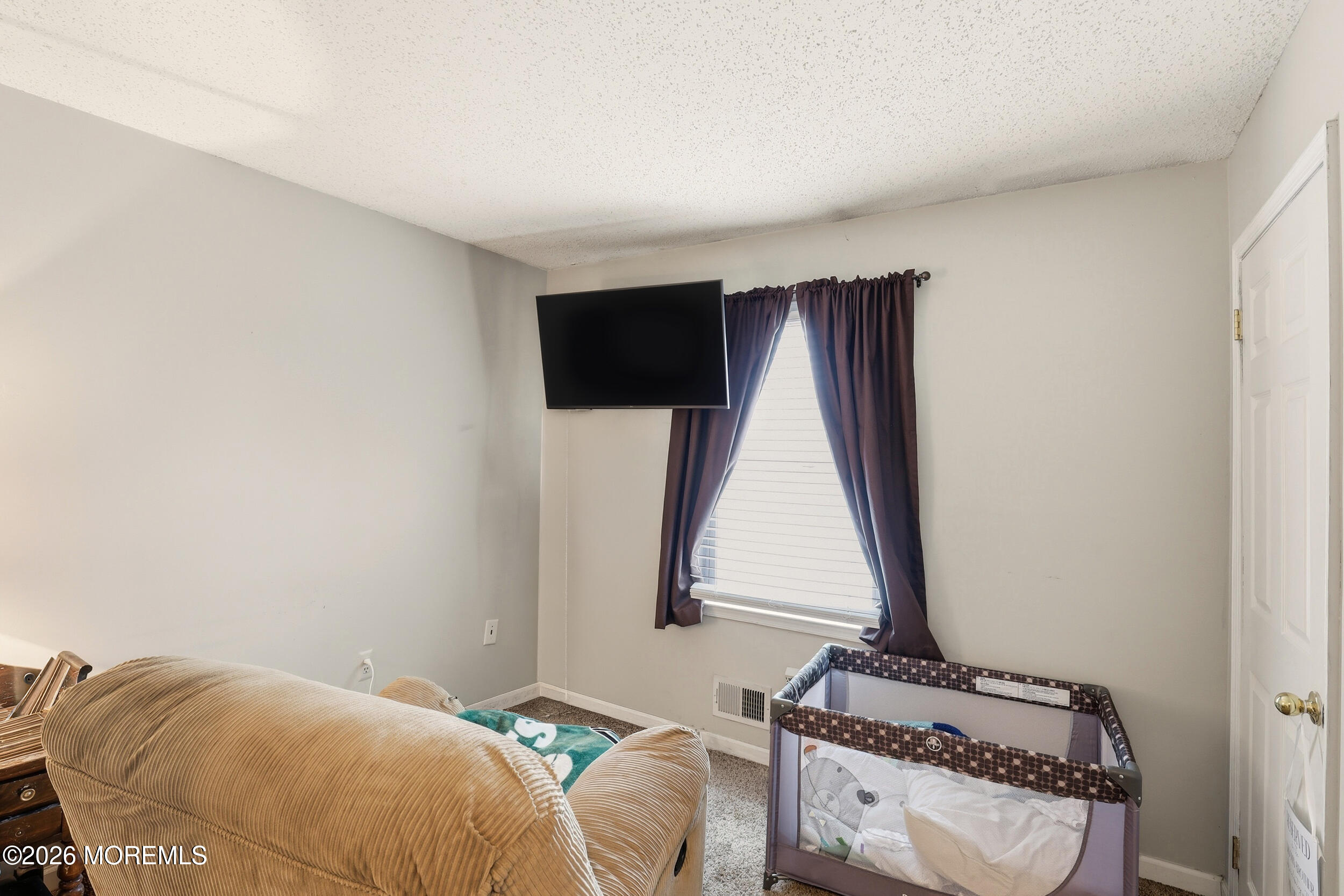 1 Mimi Lane Howell, NJ 07731 - Photo 22 of 26 a bedroom with a bed and a window