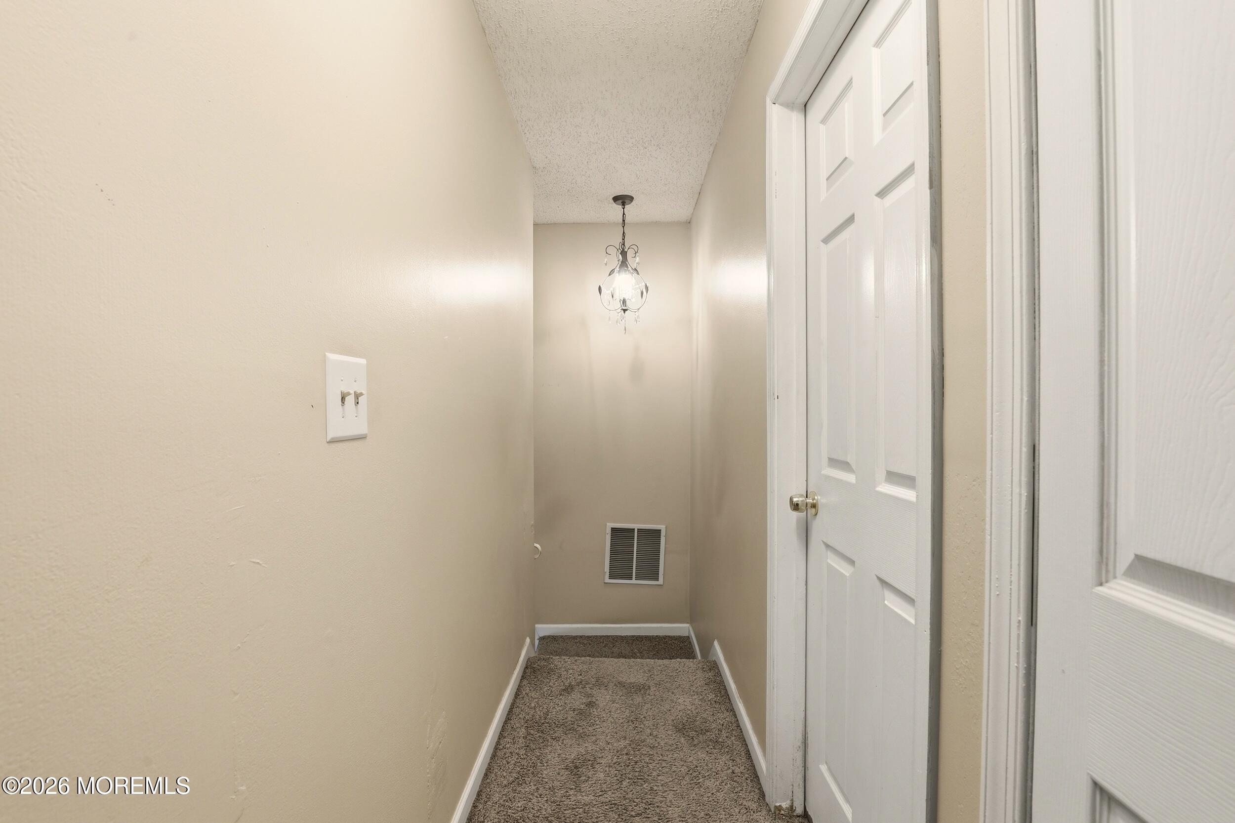 1 Mimi Lane Howell, NJ 07731 - Photo 24 of 26 a view of a hallway with wooden floor