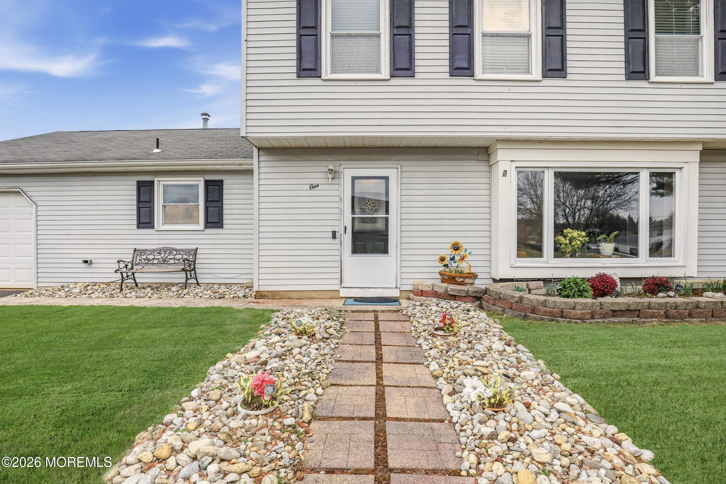 1 Mimi Lane Howell, NJ 07731 - Photo 4 of 26 a front view of a house with garden