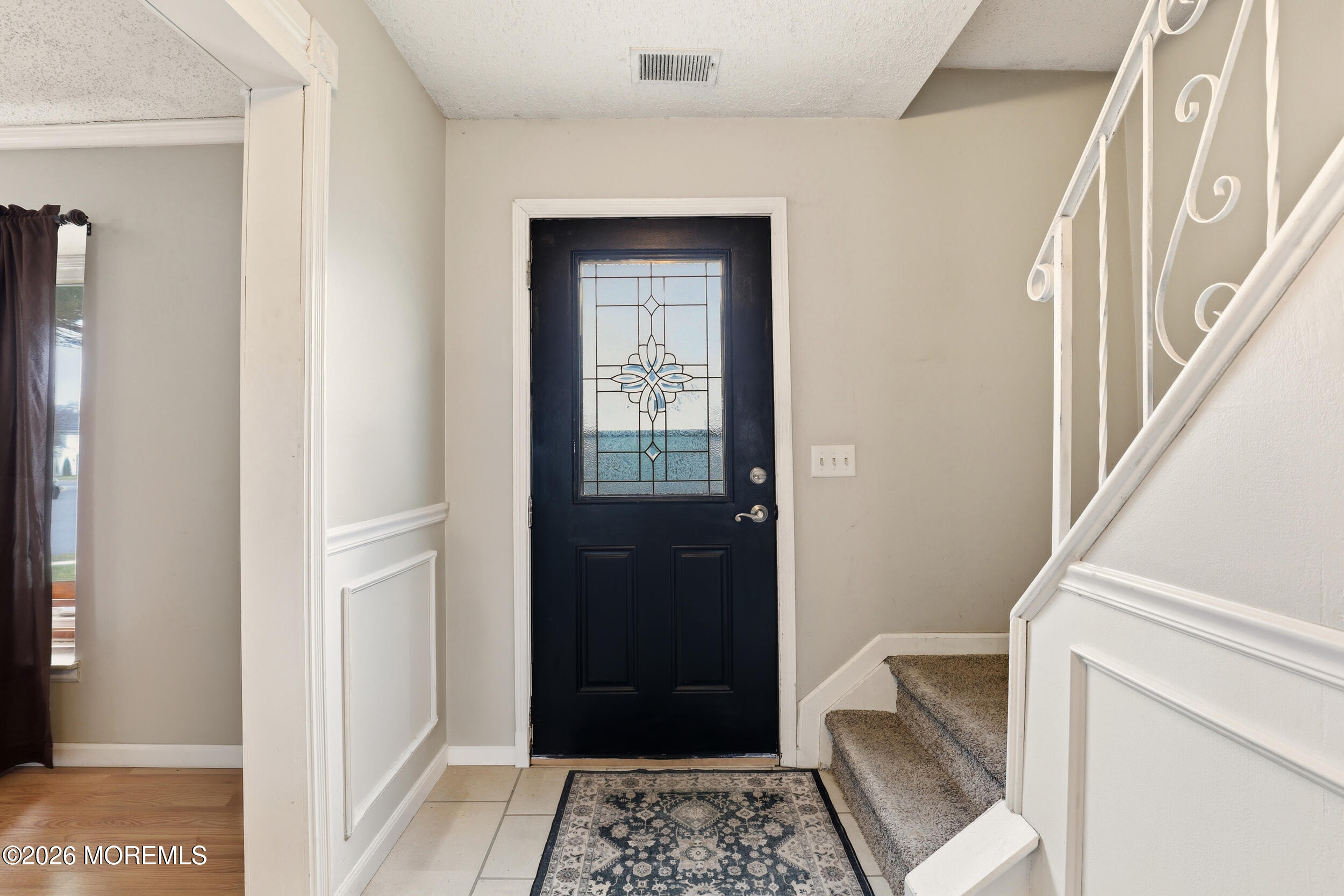 1 Mimi Lane Howell, NJ 07731 - Photo 5 of 26 a view of an entryway with a table and chair