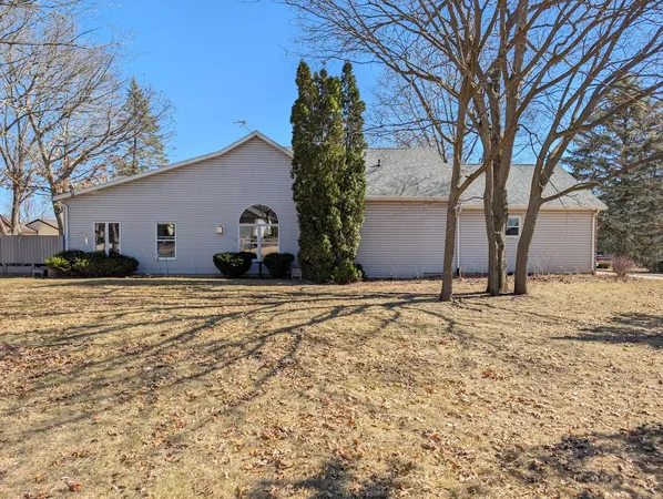 a view of a house with snow on the road