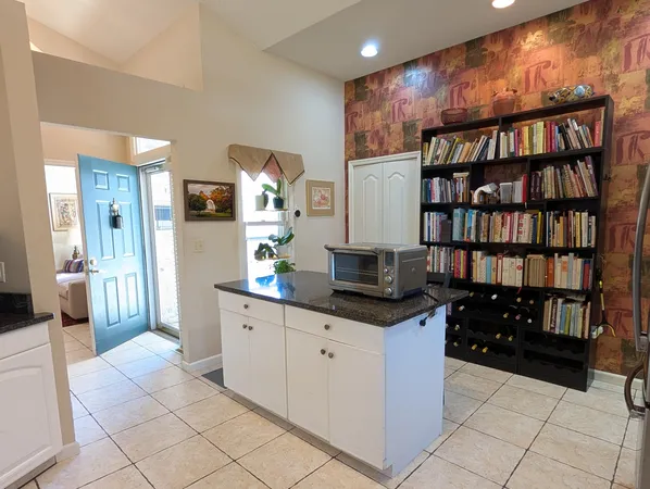 a kitchen with stainless steel appliances a cabinets and a counter top space